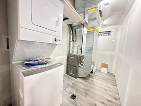 Trenton apartment for rent - A small laundry room with a washer and dryer.