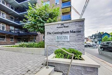 Toronto apartment for rent - The Cottingham Manor Rental Suites sign in front of a building.