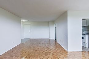Don Mills apartment for rent - A room with a wooden floor and white walls.