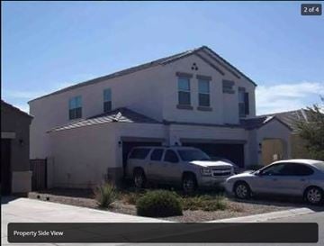 San Tan Valley house for rent - A house with a silver car parked in front.