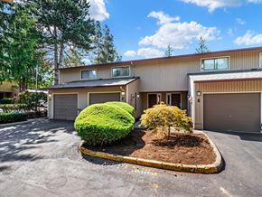 Vancouver apartment for rent - the front of a house with a driveway and a garage door
