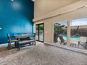 Vancouver apartment for rent - a dining room with a table and chairs next to a pool