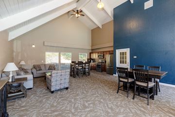 Vancouver apartment for rent - A living room with a patterned carpet and furniture.