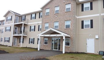 Stratford apartment for rent - Apartment building with a mix of brick and siding exteriors.
