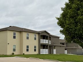 Dodge City apartment for rent - Apartment complex with a tree in front.