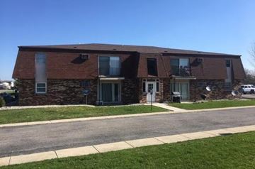 Bourbonnais apartment for rent - a brick and stone house on the side of a street