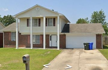 Fayetteville house for rent - a house with a driveway and a parking meter