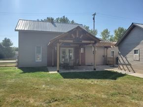 Elida house for rent - the front porch of a house with a patio and awning