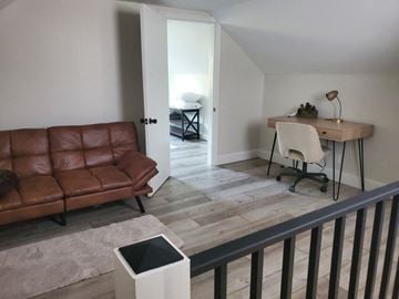 Elida house for rent - a living room with a couch and a desk