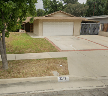 Rowland Heights apartment for rent - a house with a yard and a parking meter on the sidewalk