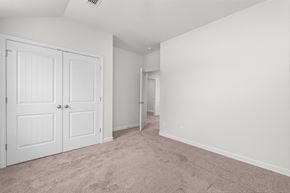Aiken house for rent - an empty bedroom with white doors and carpeting