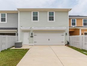 Aiken house for rent - a white house with a white fence and a driveway