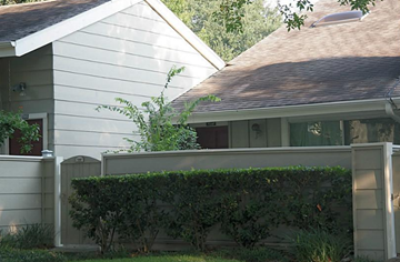 Houston house for rent - a white house with a hedge in front of it