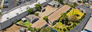 Vista apartment for rent - an aerial view of a neighborhood with houses and a street