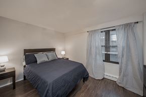 Chicago apartment for rent - an empty bedroom with a bed and a window