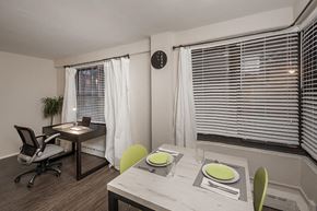 Chicago apartment for rent - a dining room with a table and chairs and a window