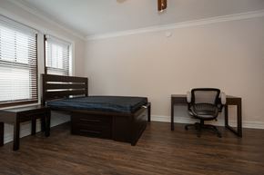 Chicago apartment for rent - an empty room with a bed and a desk and a chair