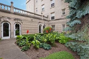 Chicago apartment for rent - the outside of a building with a garden in front of it