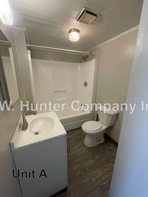 Stantonsburg apartment for rent - A bathroom with a sink, toilet and mirror.