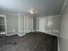 Stantonsburg apartment for rent - A room with a wooden floor and white walls, with a light fixture on the ceiling.
