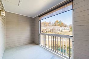Nashville house for rent - the living room has a large window and a balcony