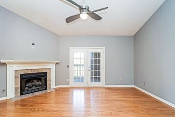 Nashville house for rent - an empty living room with a fireplace and a ceiling fan