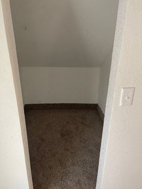 Clinton house for rent - an empty room with a carpet floor and a white wall
