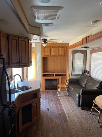 Clinton apartment for rent - an rv living room with a couch and a kitchen