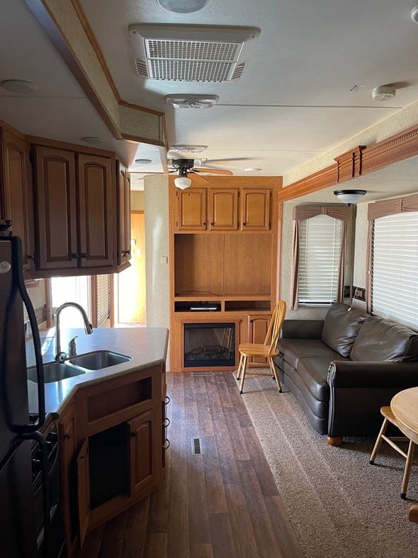 Clinton apartment for rent - an rv living room with a couch and a kitchen