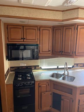 Clinton apartment for rent - a kitchen with a sink and a stove and a microwave