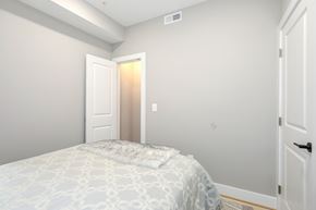 Washington apartment for rent - a bedroom with a bed and a door to a closet
