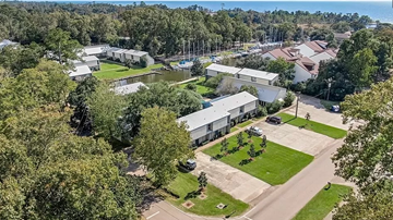 Mandeville apartment for rent - an aerial view of a neighborhood with houses and trees