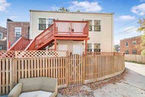Washington apartment for rent - a house with a fence and a couch in front of it