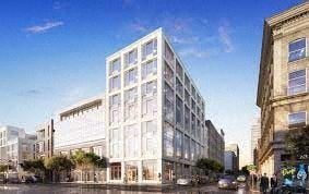Newark apartment for rent - A modern white building with many windows is situated on a street with other buildings.