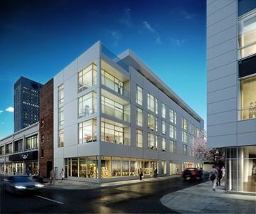 Newark apartment for rent - A modern building with large windows is shown in the image.