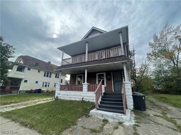 Cleveland apartment for rent - the front of a house with stairs and a porch