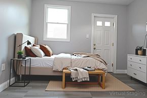 Philadelphia apartment for rent - A bedroom with a bed, nightstand, and window.