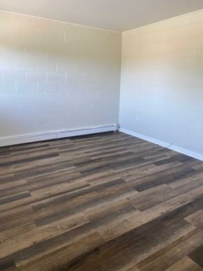 Wolfville apartment for rent - a room with wooden floors and white walls