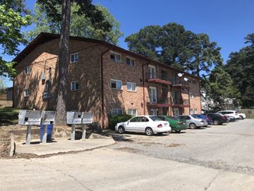 Durham apartment for rent - an apartment building with cars parked in front of it