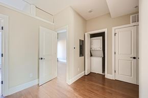 Baltimore apartment for rent - A room with a white door and a white fridge.