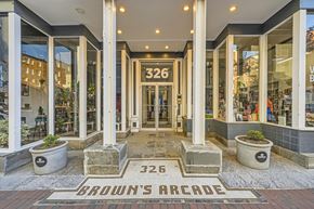 Baltimore apartment for rent - The front of a building with the number 326 and the words Brown's Arcade on the ground.
