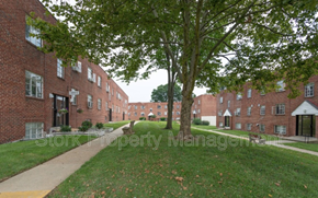Baltimore apartment for rent - a sidewalk in front of a brick building