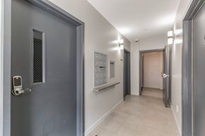 Philadelphia apartment for rent - A hallway with a grey door on the left and a white door on the right.