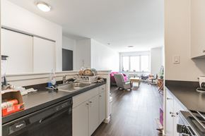 Philadelphia apartment for rent - A kitchen with a black dishwasher and a black stove top.