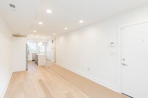 Philadelphia apartment for rent - a long hallway with white walls and wood floors