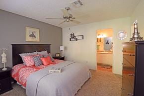 Las Vegas apartment for rent - a bedroom with a bed and a ceiling fan
