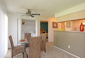 Henderson apartment for rent - a dining room with a table and chairs and a kitchen