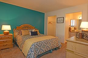 Henderson apartment for rent - a bedroom with a bed and a door to a bathroom