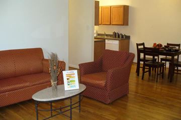 Richmond apartment for rent - a living room with a couch and chairs and a table