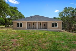 Spring Branch apartment for rent - the front of a house with grass and trees